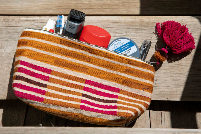 Textile cosmetic bag with various items