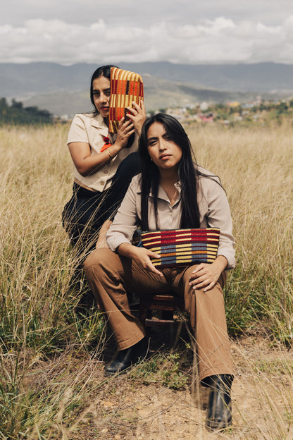 Two Women posing with Weekender Cosmetic Pouches